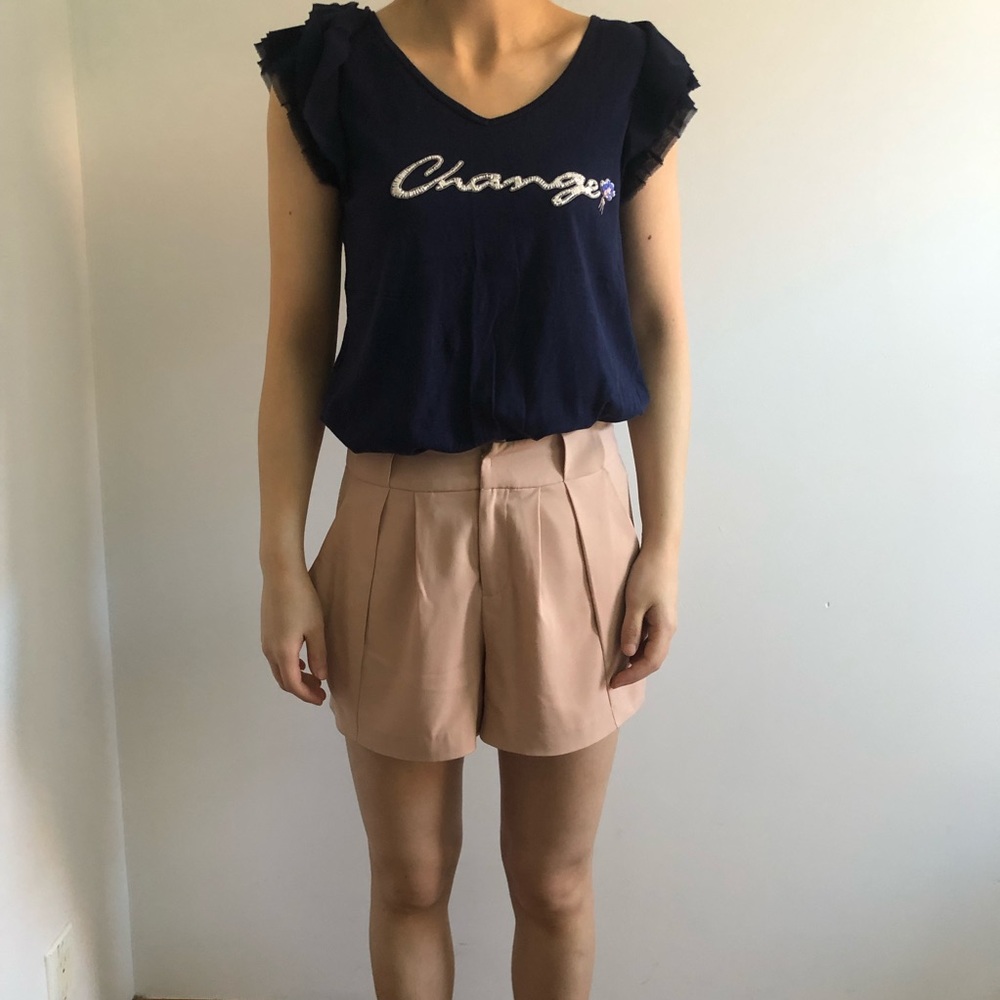 Navy blue top and beige trouser shorts